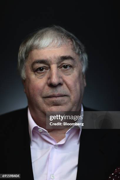 Mikhail Gutseriev, chairman of RussNeft OAO, poses for a photograph during the St. Petersburg International Economic Forum at the Expoforum in Saint...