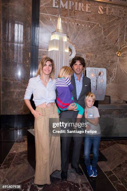 Nacho Figueras poses for a photo with wife Delfina Blaquier and childern during the lighting of The Empire State Building In Celebration Of 10th...