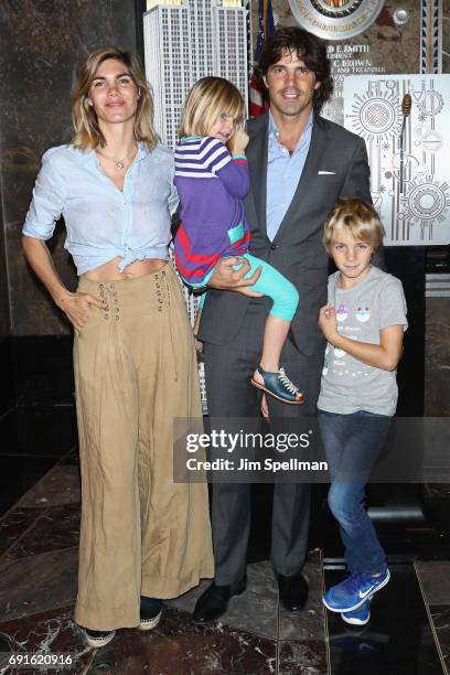 Polo player Nacho Figueras with wife Delfina Blaquier and children light the Empire State Building in celebration of 10th anniversary of Veuve...