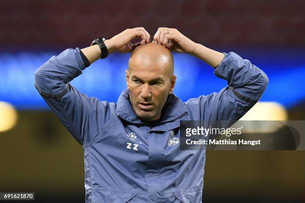Zinedine Zidane, Manager of Real Madrid reacts during a Real Madrid training session prior to the UEFA Champions League Final between Juventus and...