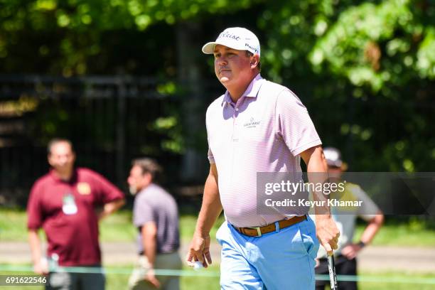 Jason Dufner smiles after making a par putt on the eighth hole green during the second round of the Memorial Tournament presented by Nationwide at...