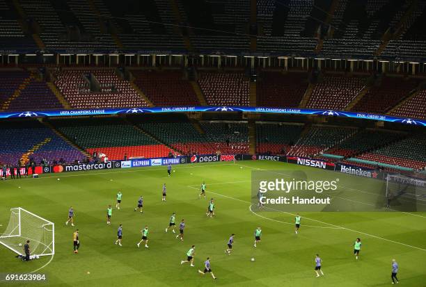 In this handout image provided by UEFA, a general view as Real Madrid players train prior to the UEFA Champions League Final between Juventus and...