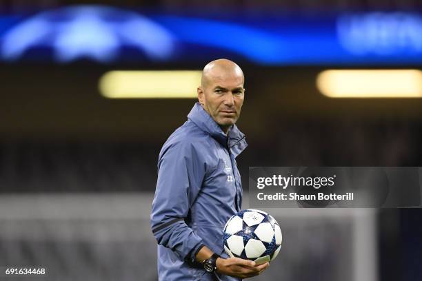 Zinedine Zidane, Manager of Real Madrid looks on during a Real Madrid training session prior to the UEFA Champions League Final between Juventus and...