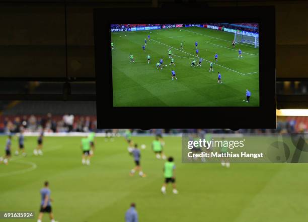 Screen shows a Real Madrid training session prior to the UEFA Champions League Final between Juventus and Real Madrid at the National Stadium of...