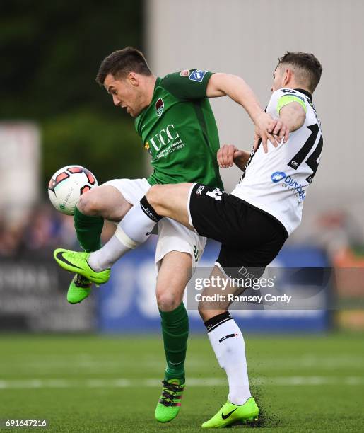 Louth , Ireland - 2 June 2017; Steven Beattie of Cork City is tackled by Dane Massey of Dundalk during the SSE Airtricity League Premier Division...