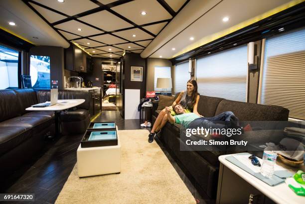 101st Indianapolis 500 Preview: Fernando Alonso with girlfriend Linda Morselli on couch in his trailer before practice session at Indianapolis Motor...