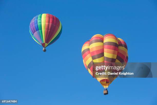 Hot air balloons fly over Temecula Valley Balloon And Wine Festival on June 2, 2017 in Temecula, California.