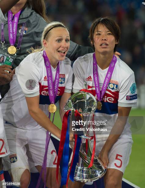 Pauline Bremer and Saki Kumagai celebrate victory in the UEFA Women's Champions League Final between Olympique Lyonnais and Paris Saint Germain on...