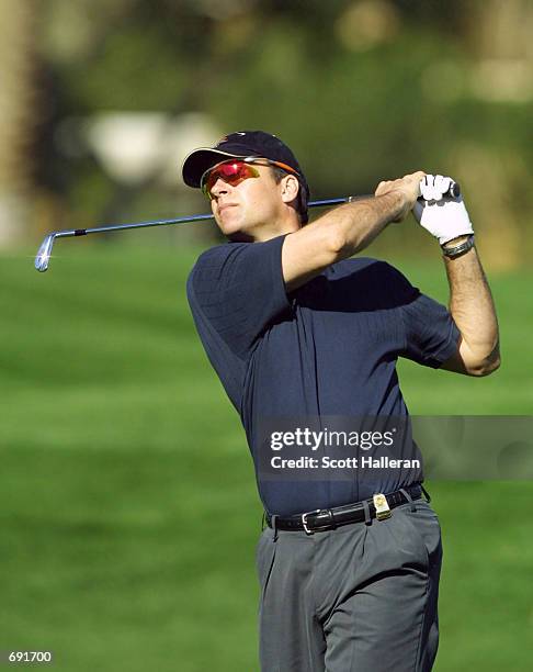 Actor David James Elliott hits a shot on the 16th hole during the opening round of the Bob Hope Chrysler Classic at Indian Wells Country Club January...