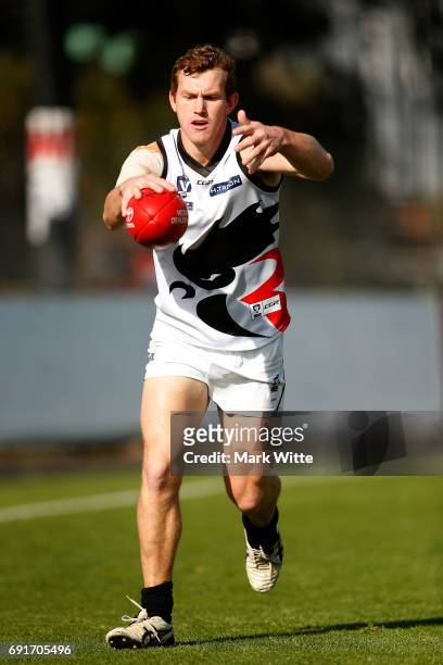 Hayden Walters of North Ballarat Roosters goes to kick the ball during the round seven VFL match between Essendon and North Ballarat on June 3, 2017...