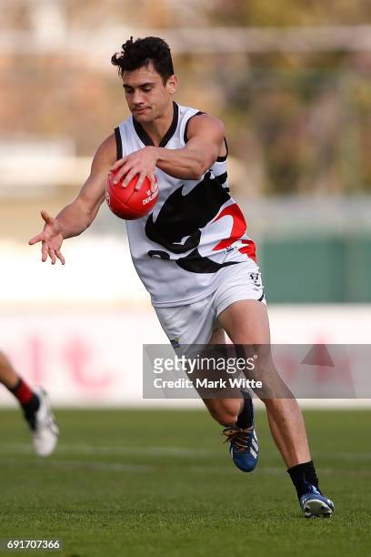 James Keeble of North Ballarat Roosters goes to kick during the round seven VFL match between Essendon and North Ballarat on June 3, 2017 in...