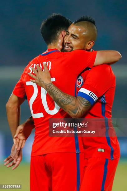 Arturo Vidal of Chile celebrates with teamamtes Gabriel Suazo after scoring the second goal of his team during a match between Chile and Burkina Faso...