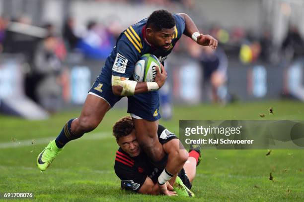 Waisake Naholo of the Highlanders is tackled by David Havili of the Crusaders during the round 15 Super Rugby match between the Crusaders and the...