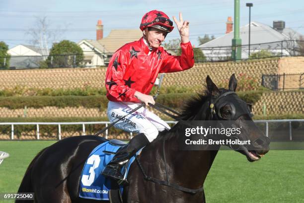 Beau Mertens returns to the mounting yard on Greviste after winning ADAPT Australia Handicap at Moonee Valley Racecourse on June 03, 2017 in Moonee...