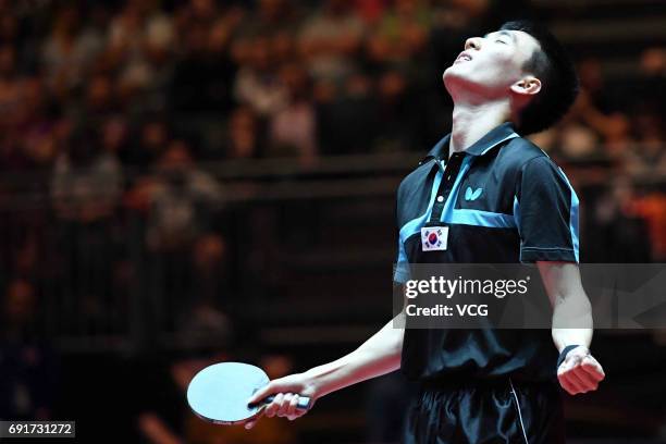 South Korean Lee Sangsu celebrates during Men's Singles third round match against Zhang Jike of China on day 5 of World Table Tennis Championships at...