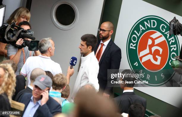 Novak Djokovic of Serbia answers to Alex Corretja of Eurosport after his victory on day 6 of the 2017 French Open, second Grand Slam of the season at...