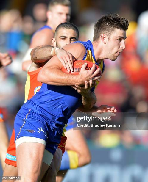 West Coast Eagles player Elliot Yeo attempts to break away from the defence during the round 11 AFL match between the Gold Coast Suns and the West...