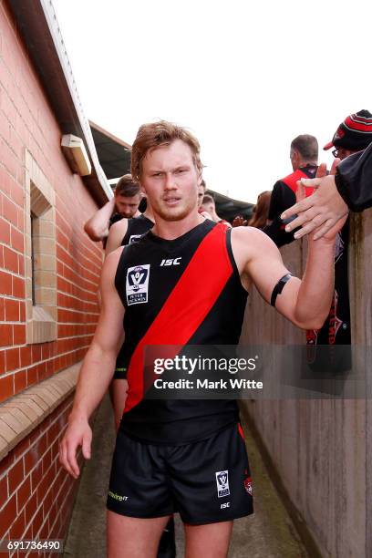 Alex Carr of Essendon Bombers walks into the changerooms after his first game during the round seven VFL match between Essendon and North Ballarat on...