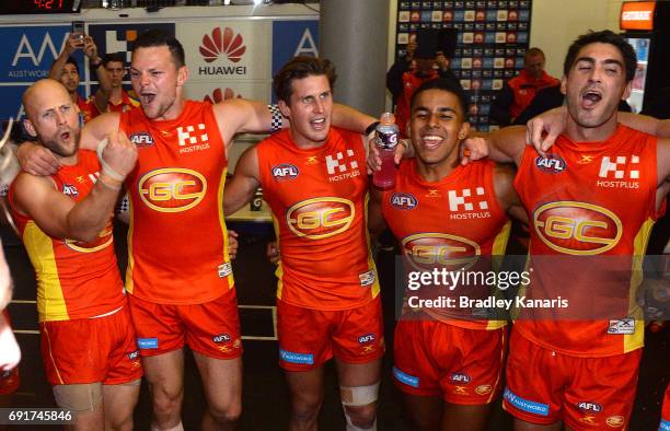 The Suns players celebrate victory after the round 11 AFL match between the Gold Coast Suns and the West Coast Eagles at Metricon Stadium on June 3,...