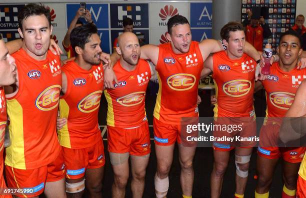 The Suns players celebrate victory after the round 11 AFL match between the Gold Coast Suns and the West Coast Eagles at Metricon Stadium on June 3,...