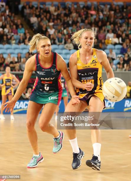 Laura Langman of the Lightning and Elizabeth Watson of the Vixens compete for the ball during the Super Netball Major Semi Final match between the...