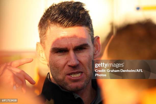 Box Hill Senior Coach Chris Newman talks to his players during the round seven VFL match between Port Melbourne and Box Hill at North Port Oval on...