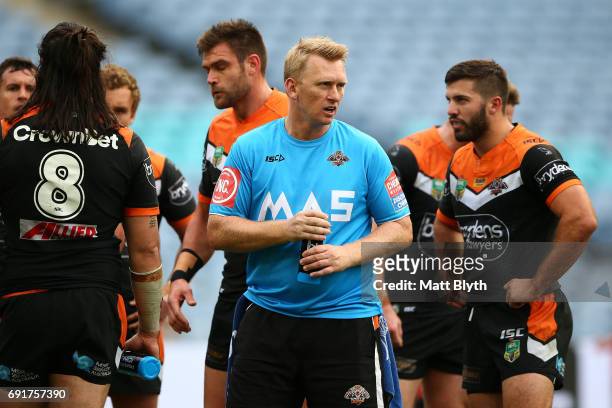 Tigers assistant coach Andrew Webster looks on during the round 13 NRL match between the St George Illawarra Dragons and the Wests Tigers at ANZ...
