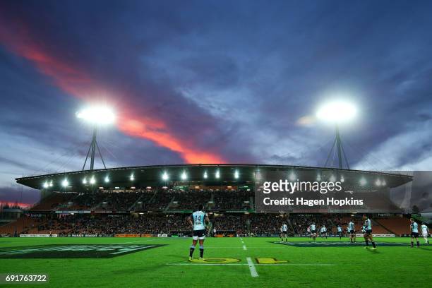The sun sets over Waikato Stadium during the round 15 Super Rugby match between the Chiefs and the Waratahs at Waikato Stadium on June 3, 2017 in...
