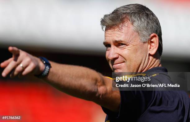 Eagles coach Adam Simpson during the round 11 AFL match between the Gold Coast Suns and the West Coast Eagles at Metricon Stadium on June 3, 2017 in...