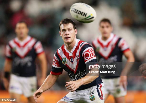 Luke Keary of the Roosters takes the ball during the round 13 NRL match between the Sydney Roosters and the Brisbane Broncos at Allianz Stadium on...