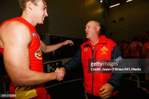 Suns coach Rodney Eade congratulates Tom Lynch during the round 11 AFL match between the Gold Coast Suns and the West Coast Eagles at Metricon...