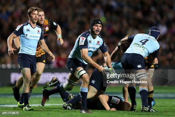 Michael Wells of the Waratahs passes during the round 15 Super Rugby match between the Chiefs and the Waratahs at Waikato Stadium on June 3, 2017 in...