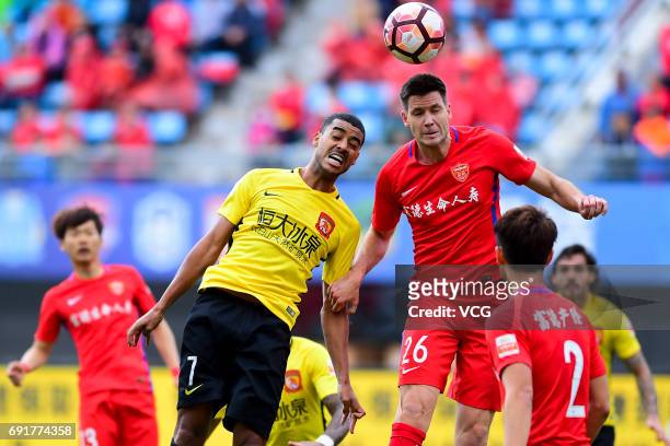 Richard Guzmics of Yanbian Fude FC and Alan of Guangzhou Evergrande compete for the ball during the 12th round match of 2017 Chinese Football...
