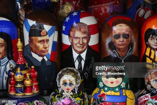 Souvenir matryoshka dolls depicting Vladimir Putin, Russia's president, left, and Donald Trump, US president, center, sit on display at a tourist...