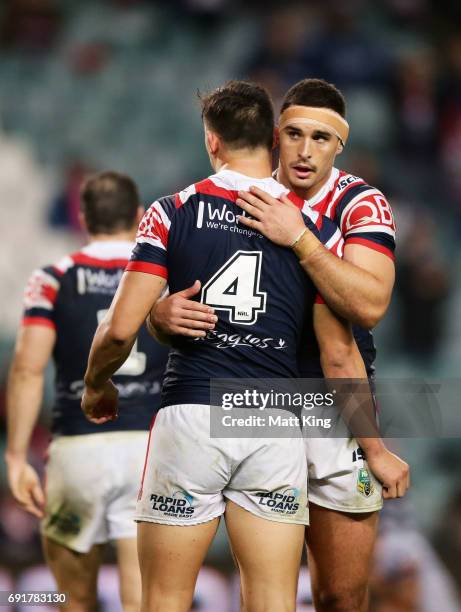 Ryan Matterson of the Roosters celebrates victory with Joseph Manu of the Roosters at the end of the round 13 NRL match between the Sydney Roosters...