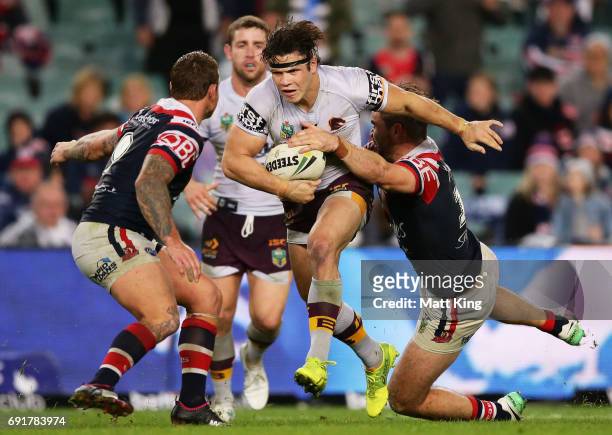 James Roberts of the Broncos is tackled during the round 13 NRL match between the Sydney Roosters and the Brisbane Broncos at Allianz Stadium on June...