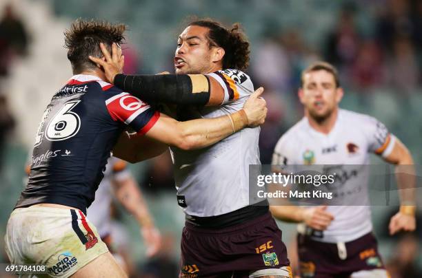 Adam Blair of the Broncos is tackled during the round 13 NRL match between the Sydney Roosters and the Brisbane Broncos at Allianz Stadium on June 3,...