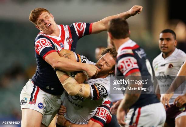 Korbin Sims of the Broncos is tackled by Dylan Napa of the Roosters during the round 13 NRL match between the Sydney Roosters and the Brisbane...