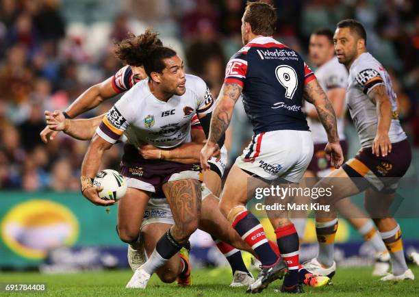 Adam Blair of the Broncos offloads the ball in a tackle during the round 13 NRL match between the Sydney Roosters and the Brisbane Broncos at Allianz...