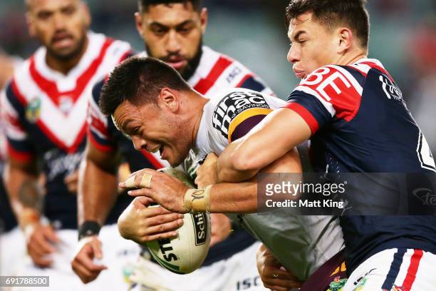 Alex Glenn of the Broncos is tackled during the round 13 NRL match between the Sydney Roosters and the Brisbane Broncos at Allianz Stadium on June 3,...