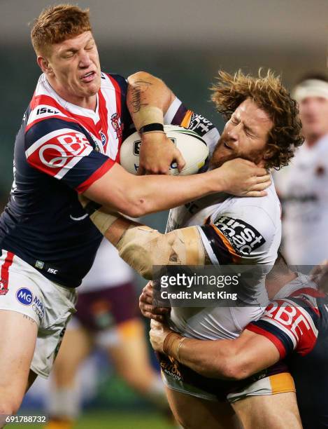 Korbin Sims of the Broncos is tackled by Dylan Napa of the Roosters during the round 13 NRL match between the Sydney Roosters and the Brisbane...