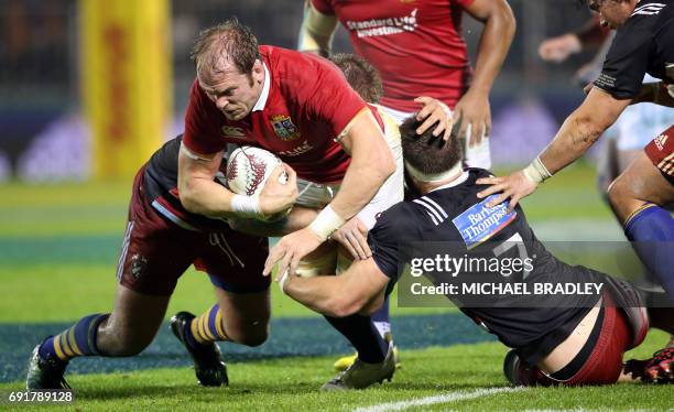British and Irish Lions' Alun Wyn Jones is tackled during the rugby match between New Zealand's Provincial Barbarians and the British and Irish Lions...