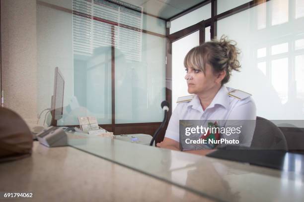 Woman from the ticket office is seen 1 June, 2017 in the departure hall of Brest central station. As the city is situated next to the Polish border...