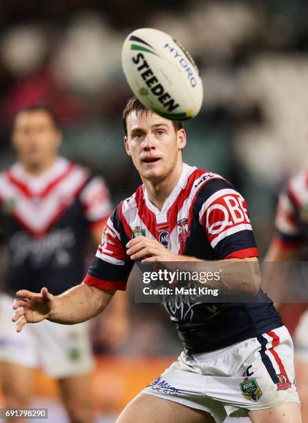Luke Keary of the Roosters takes the ball during the round 13 NRL match between the Sydney Roosters and the Brisbane Broncos at Allianz Stadium on...
