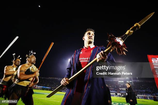 Sam Warburton of the Lions receives a Taiaha from a Maori Chief after winning the match between the New Zealand Provincial Barbarians and British &...