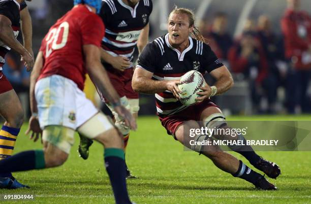 New Zealand Provincial Barbarians' Matt Matich takes the ball foward during the rugby match between New Zealand's Provincial Barbarians and the...