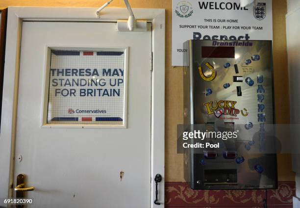An election poster is seen at an election campaign event during a visit to West Yorkshire at Thornhill Cricket and Bowling Club on June 3, 2017 in...