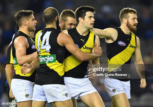 Trent Cotchin of the Tigers celebrates a goal with team mates during the round 11 AFL match between the North Melbourne Kangaroos and the Richmond...