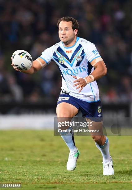 Tyrone Roberts of the Titans runs the ball during the round 13 NRL match between the North Queensland Cowboys and the Gold Coast Titans at 1300SMILES...