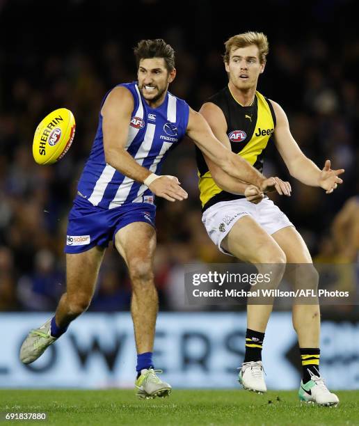 David Astbury of the Tigers and Jarrad Waite of the Kangaroos compete for the ball during the 2017 AFL round 11 match between the North Melbourne...
